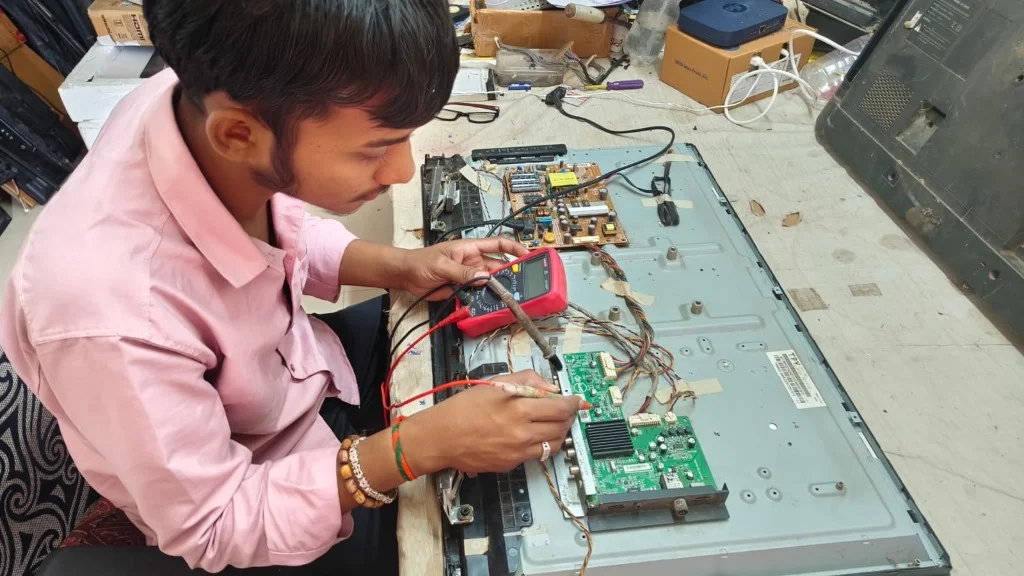 Technician testing TV